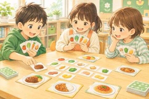 料理の具材カードを並べて遊ぶ小学生たち